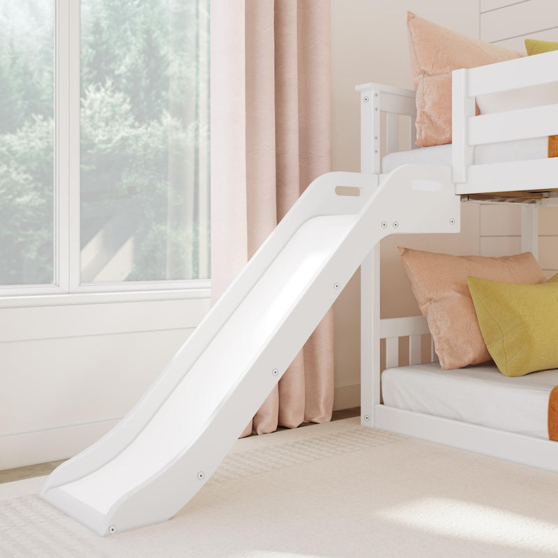 White wooden kids' bunk bed with slide, pastel pink curtains and peach-green pillows in a bright modern nursery