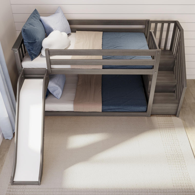 Gray wooden loft bunk bed with built-in slide and stairs, twin mattresses with blue and beige bedding and cloud pillow — space-saving kids' bedroom furniture