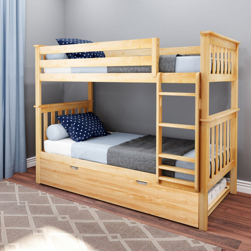 Light natural wood bunk bed with ladder and pull-out trundle, navy star pillows and blue bedding in a modern kids' bedroom