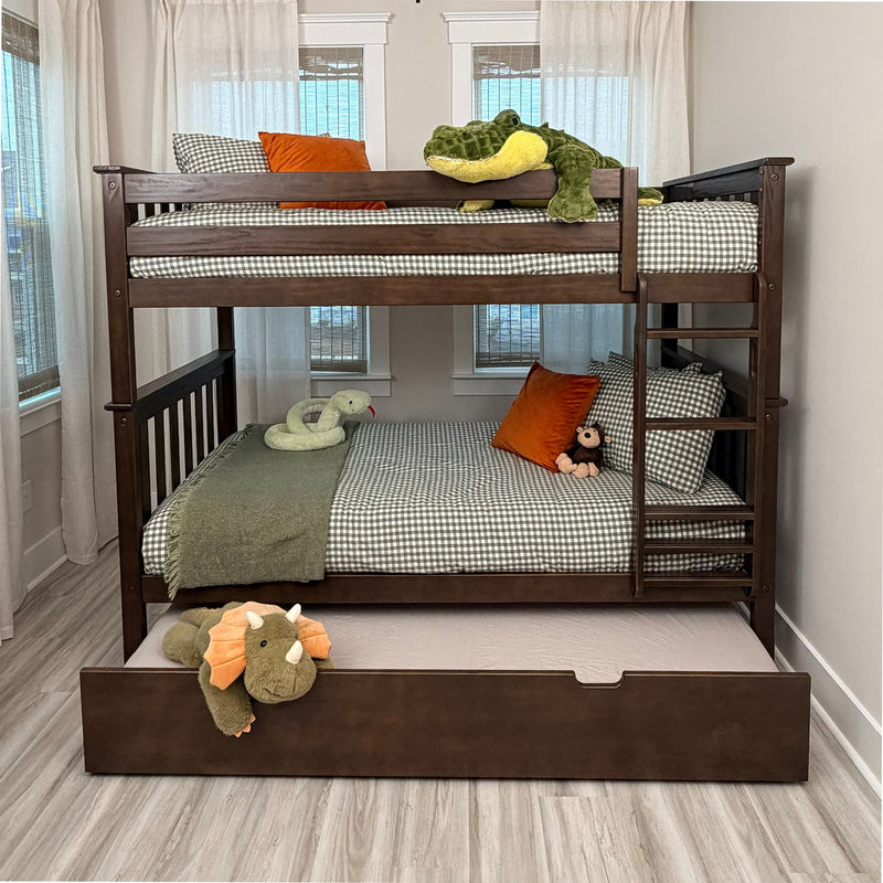 Dark wood twin-over-full bunk bed with pull-out trundle, green gingham bedding, orange throw pillows and stuffed animals in a kids' bedroom
