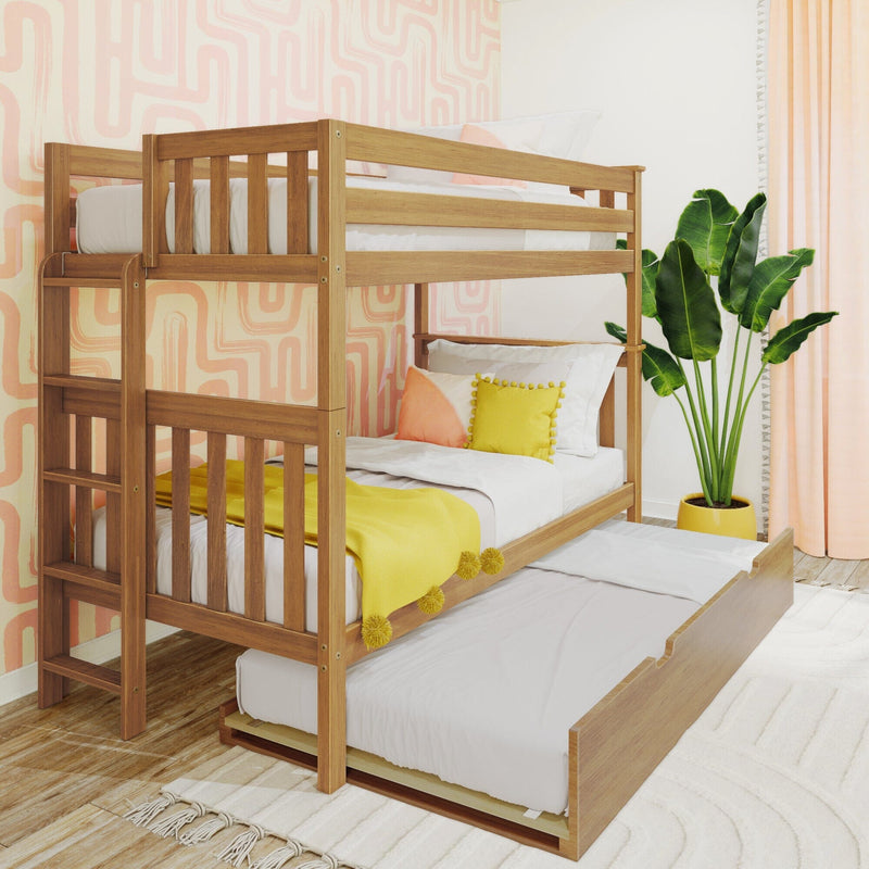 Wooden bunk bed with pull-out trundle in a bright kids' bedroom featuring pink geometric wallpaper, yellow pillows and a tropical potted plant