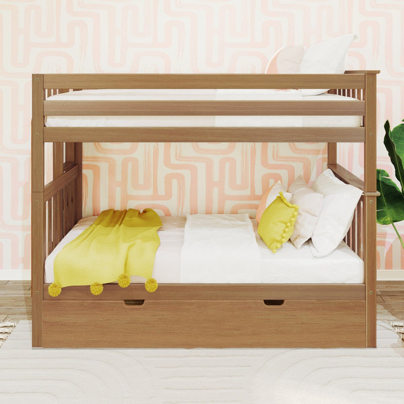 Natural wood bunk bed in a children's bedroom with pastel pink geometric wallpaper, white bedding, yellow throw blanket and pom-pom pillow, under-bed storage drawer and green plant