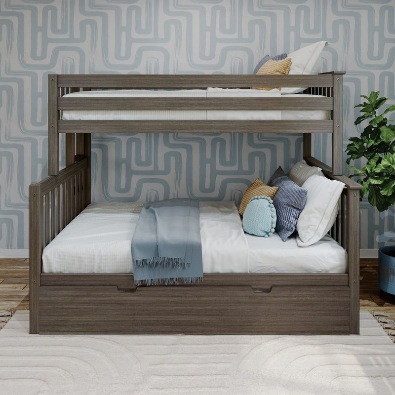 Gray-washed wooden twin-over-twin bunk bed in a modern kids' bedroom with blue geometric wallpaper, white and blue bedding, decorative pillows, under-bed storage drawer and potted plant