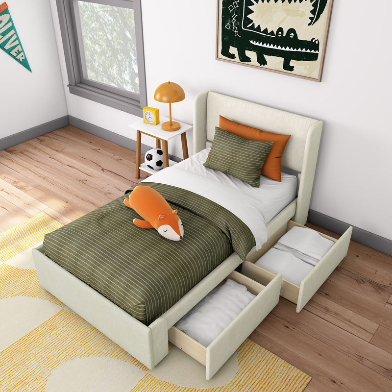 Modern kids bedroom with upholstered twin bed and pull-out under-bed storage drawers, green striped bedding, orange fox plush, nightstand with yellow lamp and clock, soccer ball and framed crocodile wall art