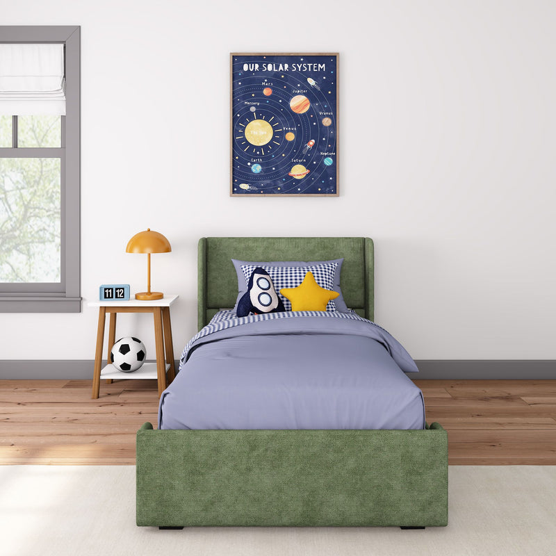 Kids bedroom with framed solar system poster above green upholstered twin bed, rocket pillow, star cushion, orange lamp.
