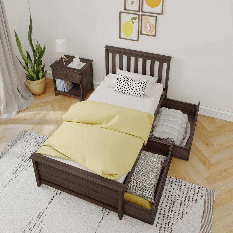 Modern small bedroom with dark wood single bed and pull-out storage drawers, yellow duvet, polka-dot pillow, wooden nightstand, potted plant and framed fruit wall art