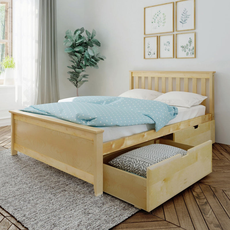 Scandinavian-style bedroom interior with light wood platform storage bed, open under-bed drawers, blue polka-dot duvet, white pillows, houseplant and framed botanical wall art.