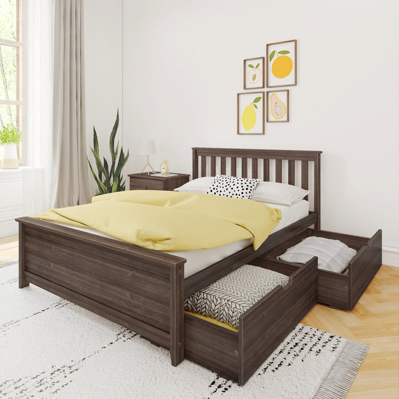 Modern dark wood platform bed with built-in pull-out storage drawers, yellow duvet and black-and-white polka dot pillow, bedside table with lamp, potted plant and framed fruit wall art in a bright minimalist bedroom
