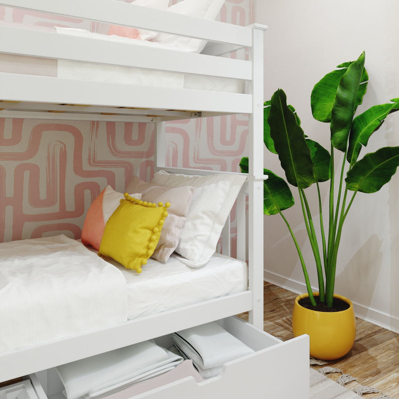 White wooden bunk bed with under-bed storage, yellow accent pillow and potted plant in modern kids' bedroom with pink geometric wallpaper