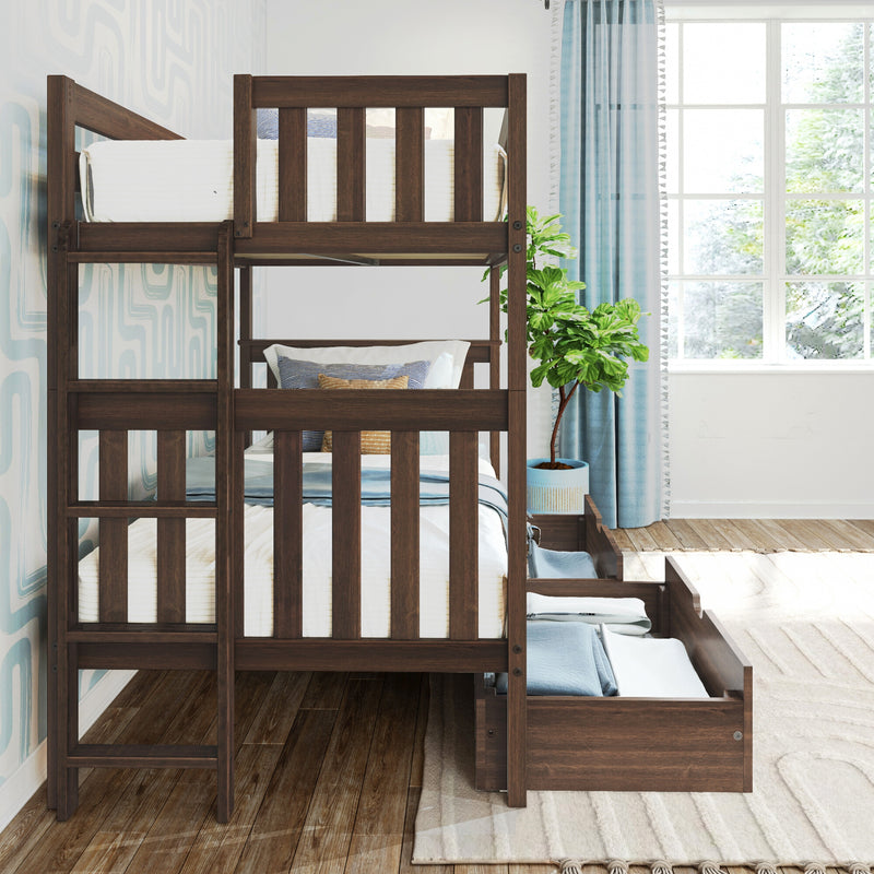 Dark walnut solid wood twin-over-twin bunk bed with slatted guardrails, built-in ladder and pull-out storage drawers, styled in a bright kids’ bedroom with white bedding, blue curtains and potted plant