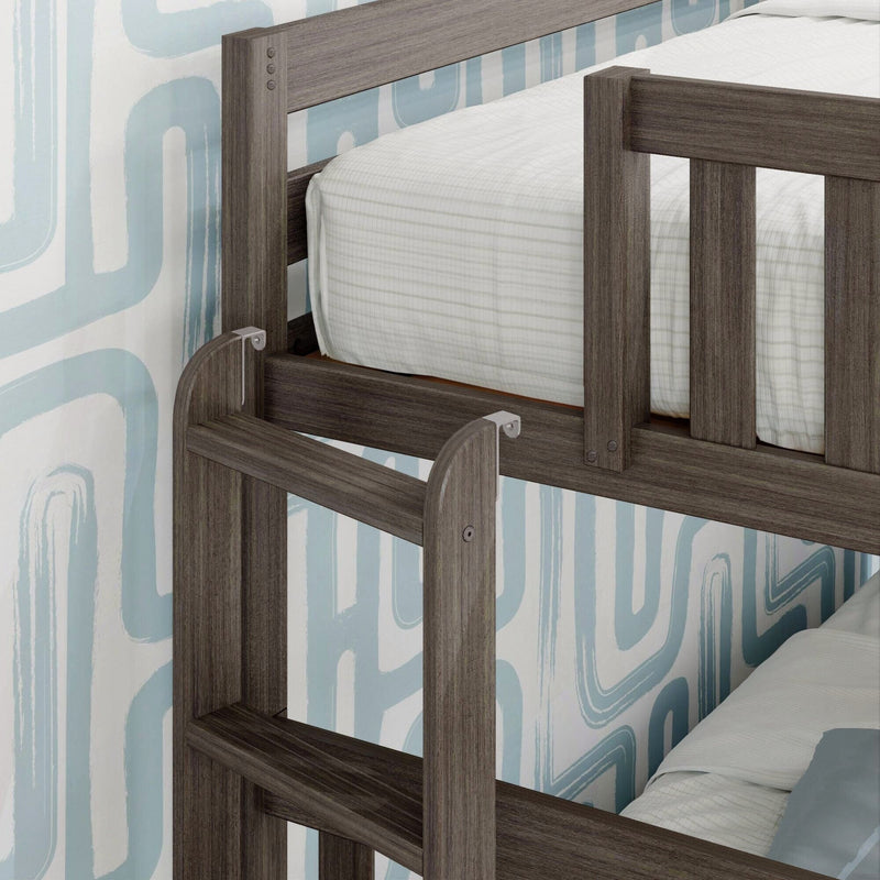 Close-up of a modern gray wood bunk bed ladder and guardrail with white striped mattress and blue abstract wallpaper, kids bedroom furniture