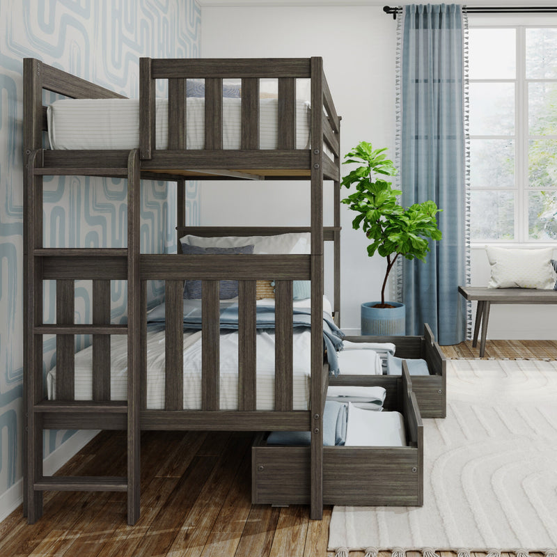 Gray wooden bunk bed with built-in storage drawers, ladder and white striped bedding in coastal kids bedroom with blue curtains and potted fiddle-leaf fig