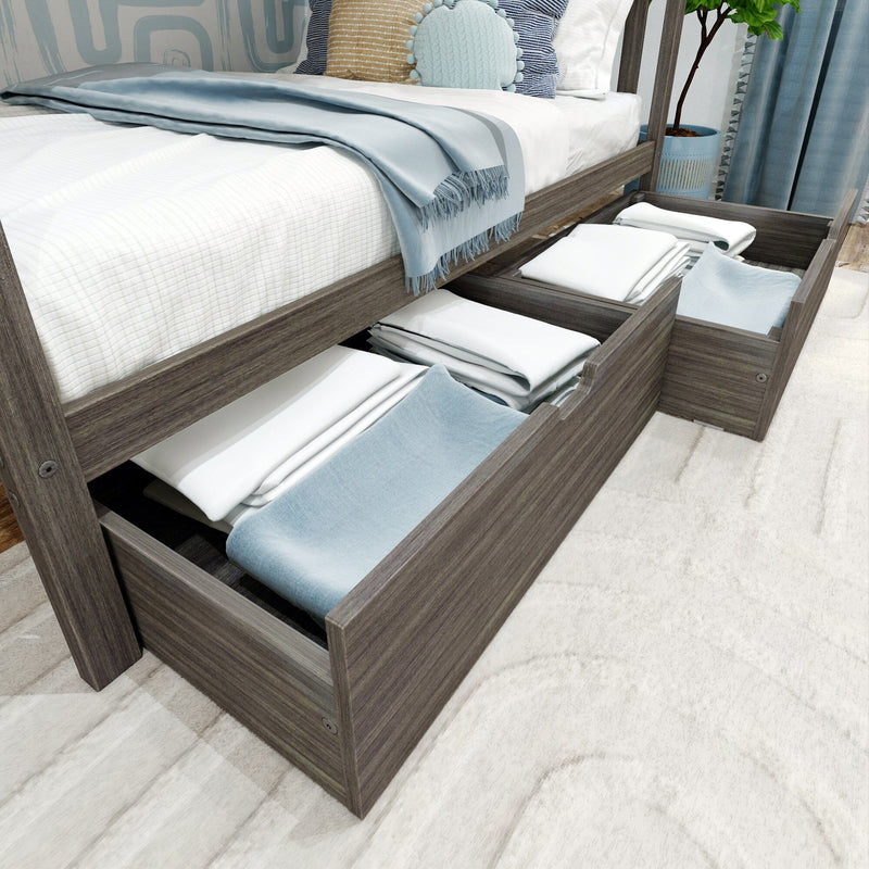 Modern gray wood platform bed with open under-bed storage drawers holding neatly folded white linens and light blue throws