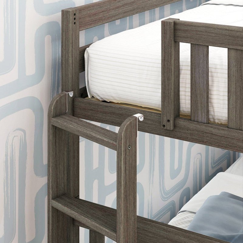 Gray wood bunk bed ladder and safety guardrail with white striped bedding against blue geometric wallpaper in children's bedroom