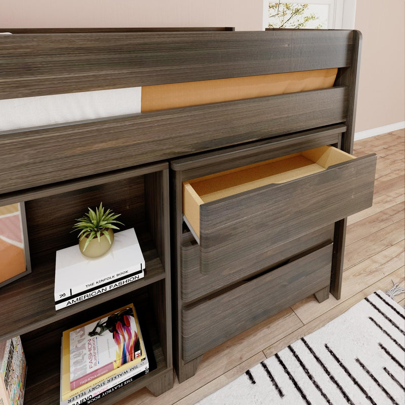 Modern gray wood loft bed with built-in drawers and open shelving, open drawer visible alongside stacked books and a potted plant on hardwood floor rug