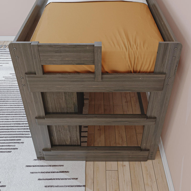 Top-down view of a rustic gray wooden bunk bed with orange mattress, hardwood floor and striped rug in a modern children's bedroom