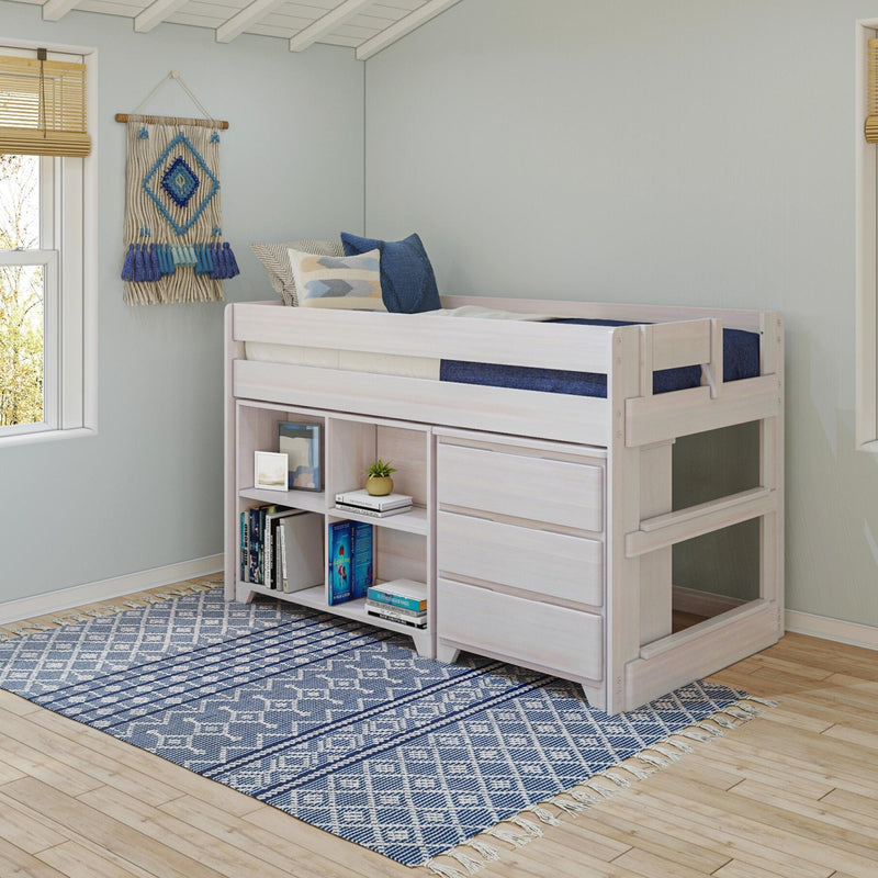 Light-wood loft bed with built-in storage, blue patterned rug, decorative blue pillows and macramé wall hanging on light gray walls in a modern kids' bedroom