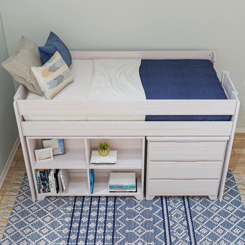 White wooden loft bed with navy blue bedding and decorative pillows, built-in shelves and drawers, and a blue geometric patterned rug