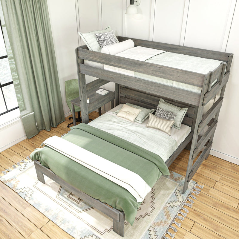 Rustic gray wooden loft bunk bed (twin over full) with green bedding, patterned pillows and built-in desk in bright farmhouse bedroom