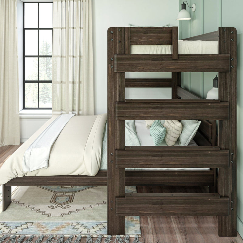 Dark-stained twin-over-twin bunk bed in modern rustic bedroom with neutral bedding, mint accent wall, sheer curtains and pendant lamp