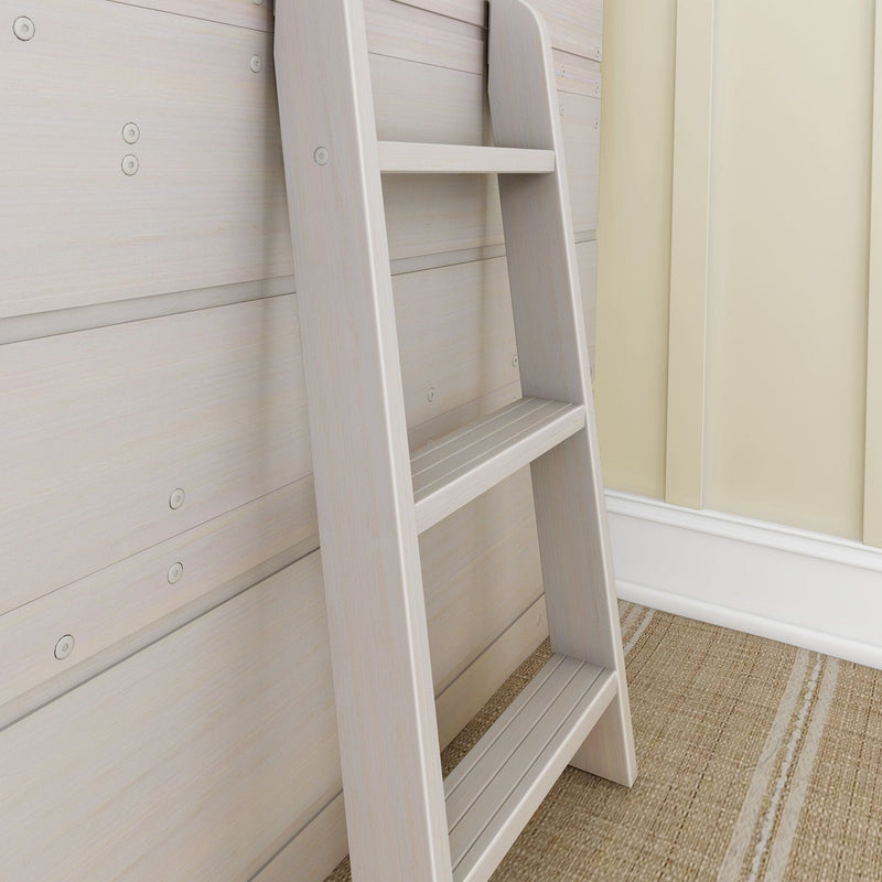 Close-up of a light wood ladder leaning against whitewashed wood-paneled wall in a bright neutral interior, showing ladder rungs, visible screw hardware and woven jute rug, ideal for modern coastal bedroom decor