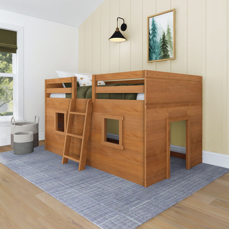 Wooden kids loft bunk bed with ladder and playhouse cubby in neutral children's bedroom with wall sconce and framed forest artwork
