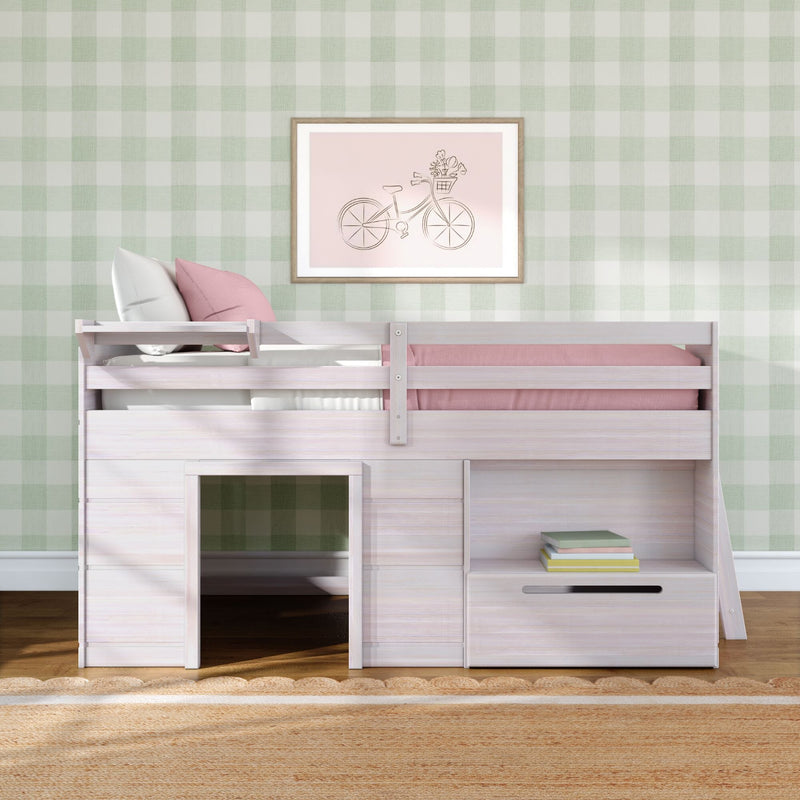 Light wood kids bunk bed with pink bedding and storage drawers against green gingham wallpaper and framed bicycle wall art, stylish children’s bedroom decor