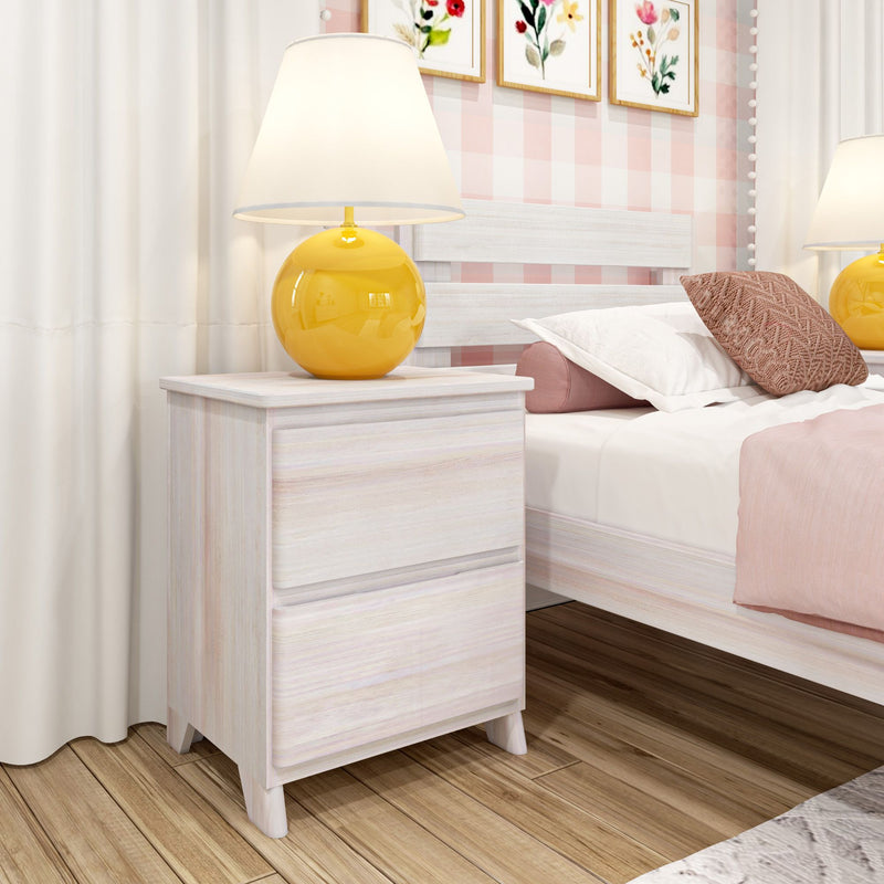 White wooden nightstand with glossy yellow table lamp, pink gingham accent wall, floral framed art and cozy pink-and-white bedding in a modern bedroom