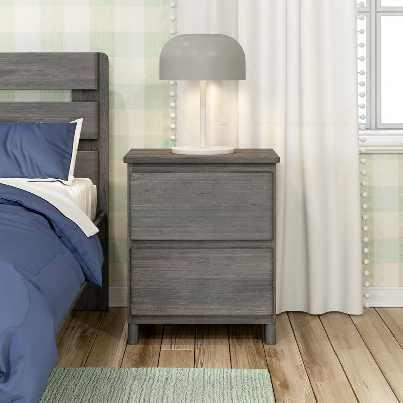 Modern gray table lamp on rustic gray wood nightstand beside bed with navy blue bedding, white curtains, green plaid wallpaper and hardwood floor
