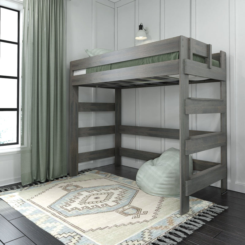 Gray wooden loft bunk bed in modern kids bedroom with green curtains, patterned rug, bean bag and wall sconce lighting