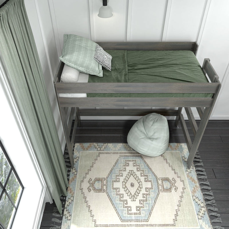 Modern wooden loft bed with green bedding and patterned throw pillow, matching pale green curtains and boho area rug