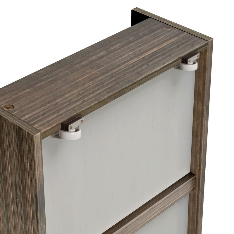 Close-up of sliding barn door hardware showing rustic gray wood top edge, metal bracket and white roller wheel for closet/wardrobe door