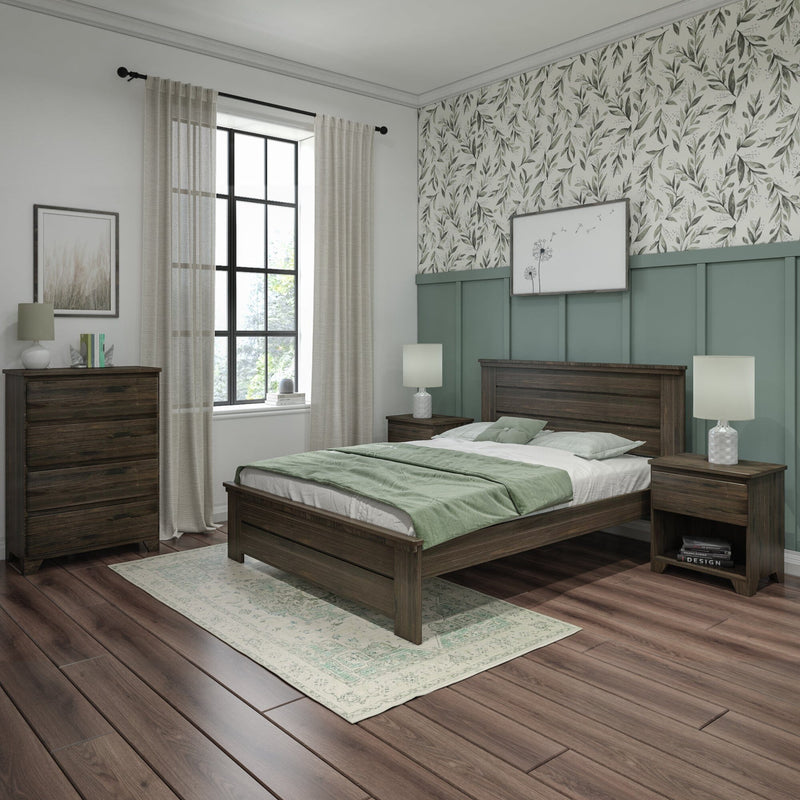 Cozy modern farmhouse bedroom with dark wood bed and nightstands, sage green paneled wainscoting, botanical wallpaper, sheer curtains, bedside lamps and hardwood floors.