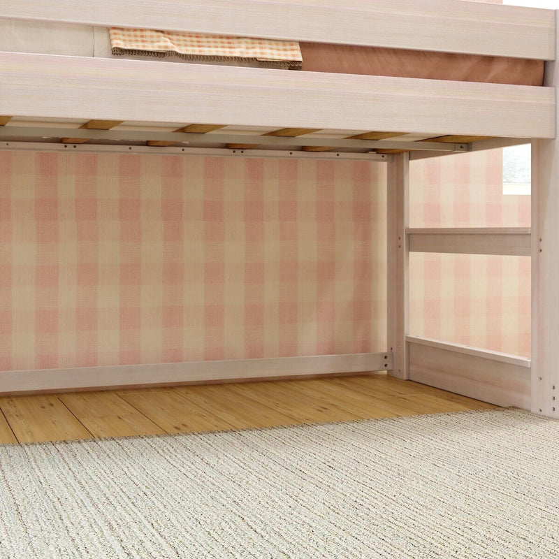 Light wood loft bed frame with ladder and slatted support, pink gingham wallpaper, hardwood floor and woven rug in a child's bedroom