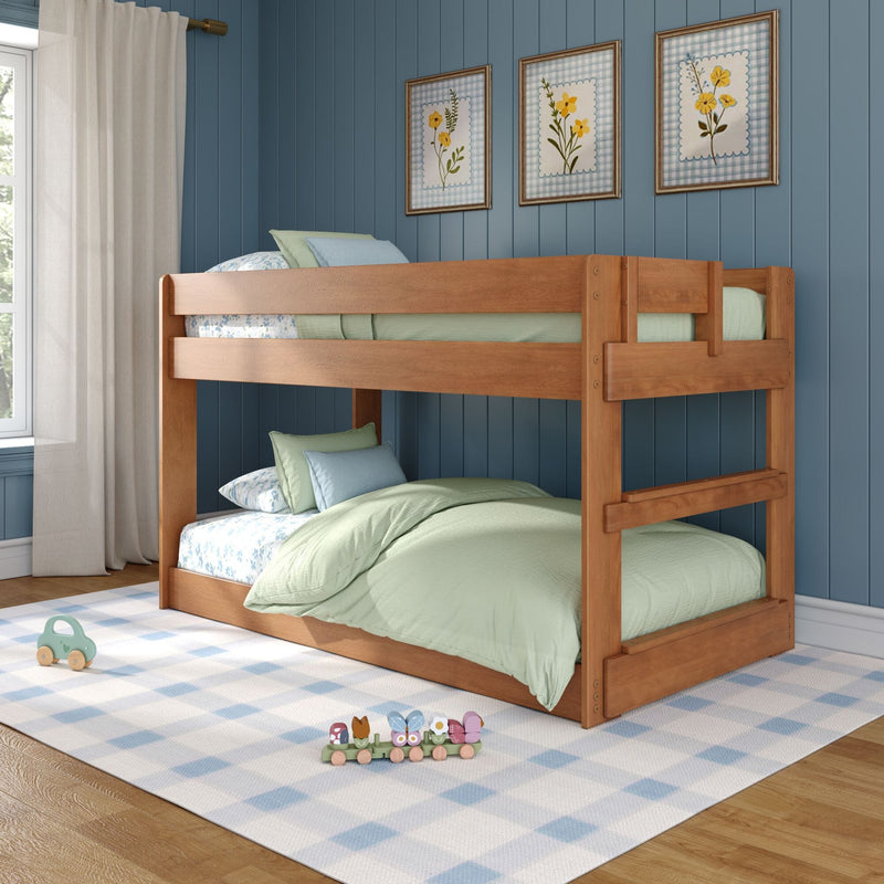 Kids wooden bunk bed with mint green bedding in coastal blue paneled bedroom, floral wall art, checkered rug and wooden toys
