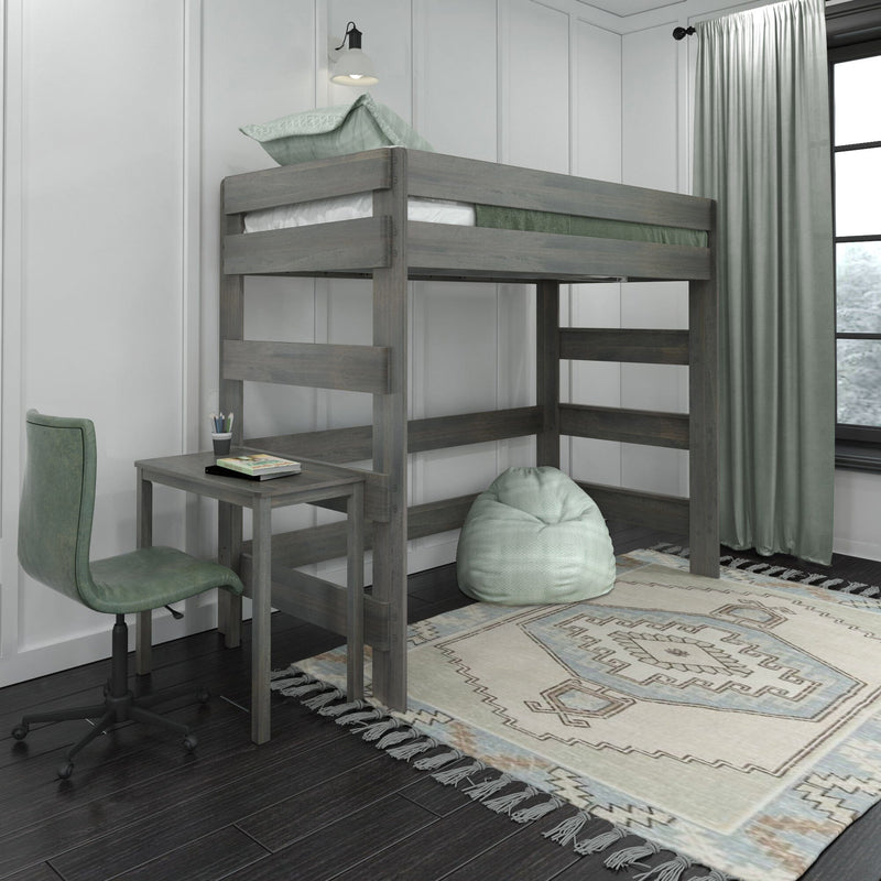 Grey wood loft bed with built-in desk, mint green bedding and bean bag chair, patterned area rug and curtains in a modern kids' bedroom workspace