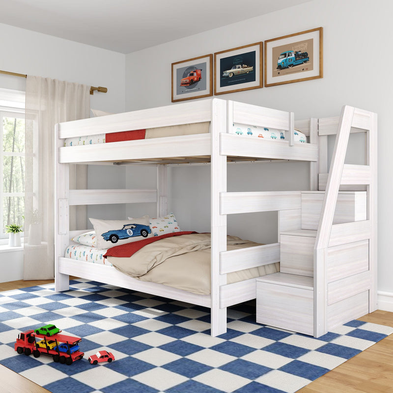 White wooden loft bunk bed with built-in staircase storage, car-themed bedding and framed car prints, blue checkered rug and toy cars in a bright kids' bedroom