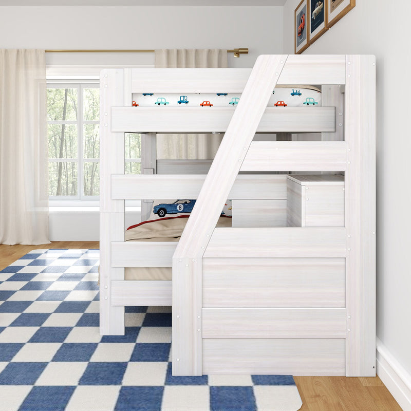 Whitewashed wooden loft bunk bed with angled ladder and car-themed bedding in a bright kids' bedroom with blue checkered rug, sheer curtains and framed car prints
