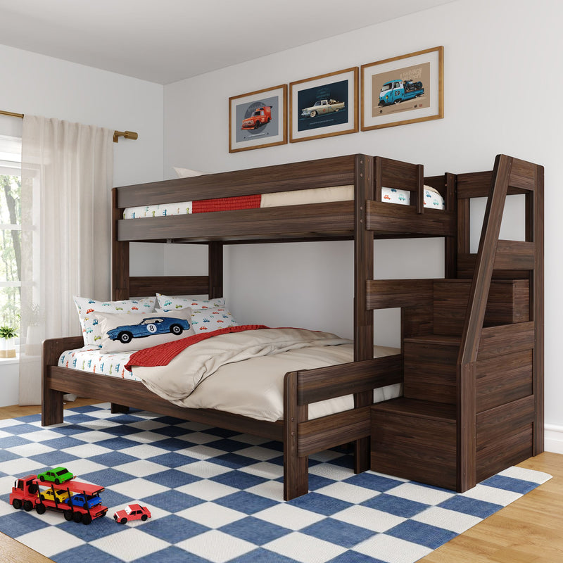 Dark wood kids bunk bed in children's bedroom with car-themed bedding and toy cars, framed vintage car prints, blue checkered rug and staircase storage