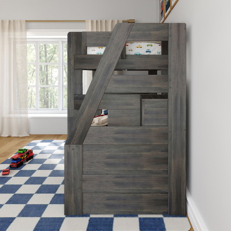 Gray wooden loft bunk bed with diagonal ladder and car-print bedding in a bright kids' bedroom with blue checkered rug and toy cars.