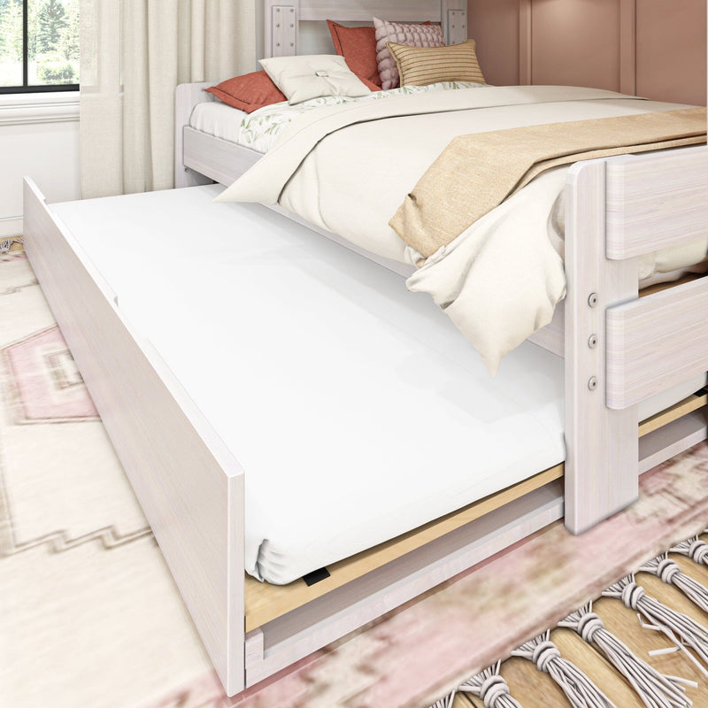 Whitewashed twin trundle bed with pull-out mattress, neutral linen bedding and decorative pillows in a modern farmhouse bedroom