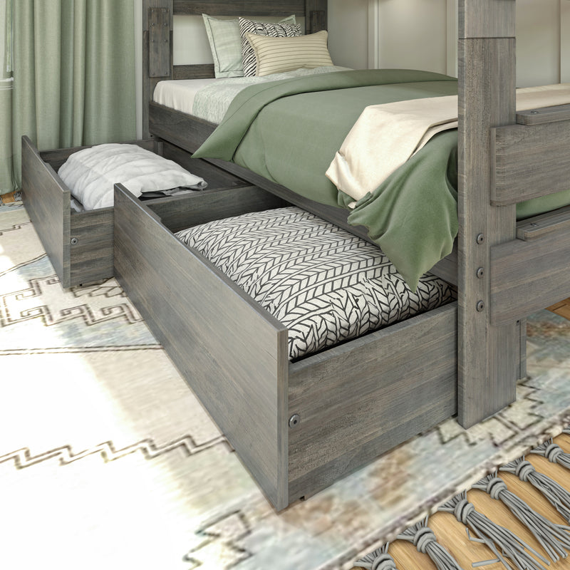 Wooden platform bed with built-in under-bed storage drawers, sage green bedding and patterned pillows in a modern rustic bedroom