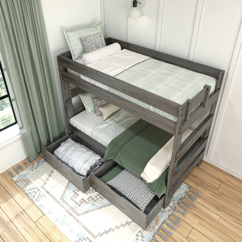Rustic gray wooden triple bunk bed with pull-out storage drawers, green and white bedding, patterned pillows and space-saving kids bedroom design