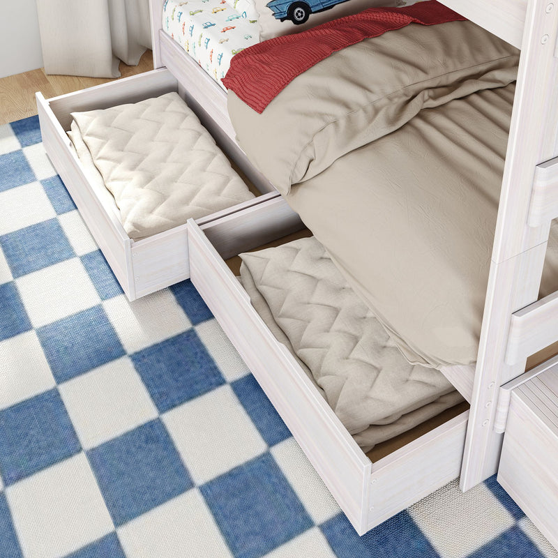 Under-bed storage drawers in white wooden kids' bed with beige bedding, red throw, car-print sheet and blue checkered rug — space-saving bedroom storage solution