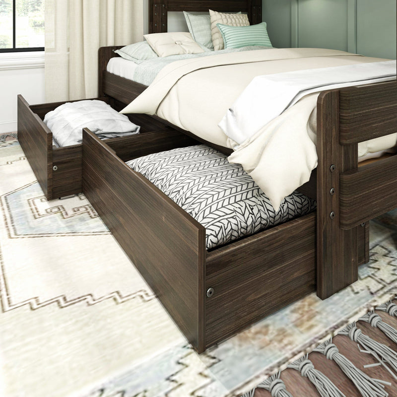 Dark wood platform storage bed with pull-out underbed drawers and trundle mattress, space-saving design styled with cream bedding and mint accent pillows.