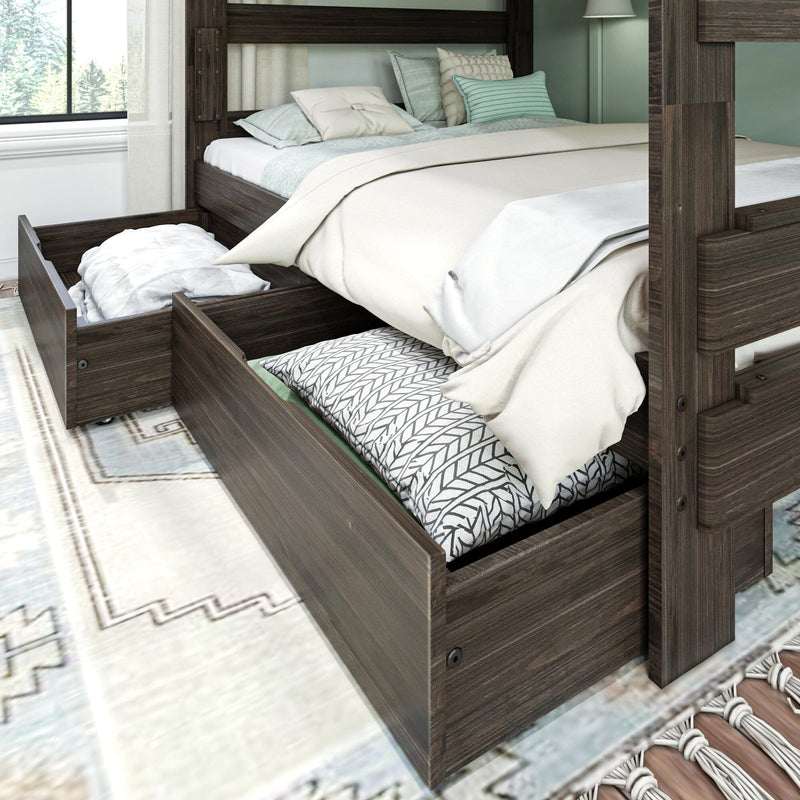 Dark wood bunk bed with open under-bed storage drawers holding pillows and linens, neutral beige and mint bedding, and a light rug in a modern farmhouse bedroom