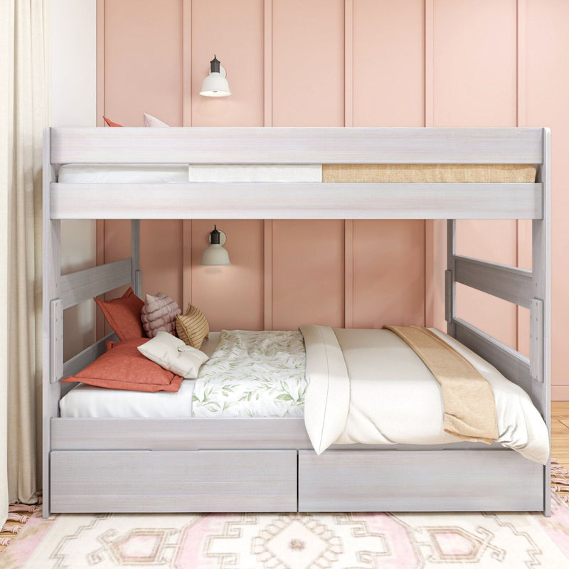 White wooden twin-over-twin bunk bed against a pink paneled wall with coral and neutral bedding, built-in storage drawers and wall sconces, modern kids bedroom decor
