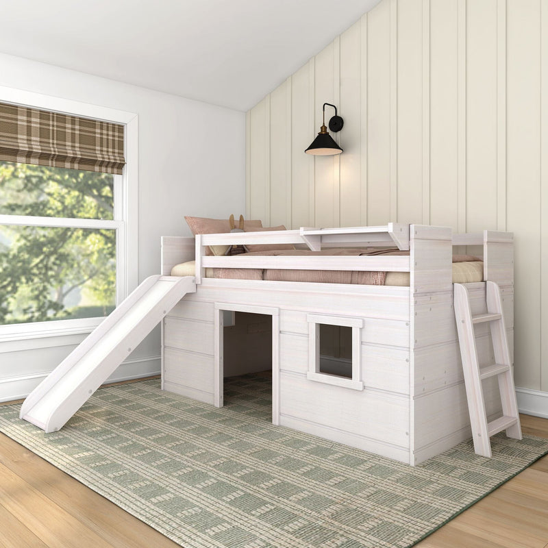 White wooden children's loft bed with slide and ladder in bright farmhouse-style bedroom with beige shiplap wall, black sconce, and plaid Roman shade