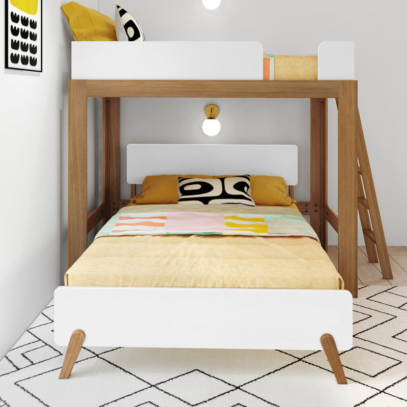Modern wooden bunk bed with white guardrails, yellow bedding and patterned pillows in a Scandinavian kids' bedroom with ladder and wall sconce