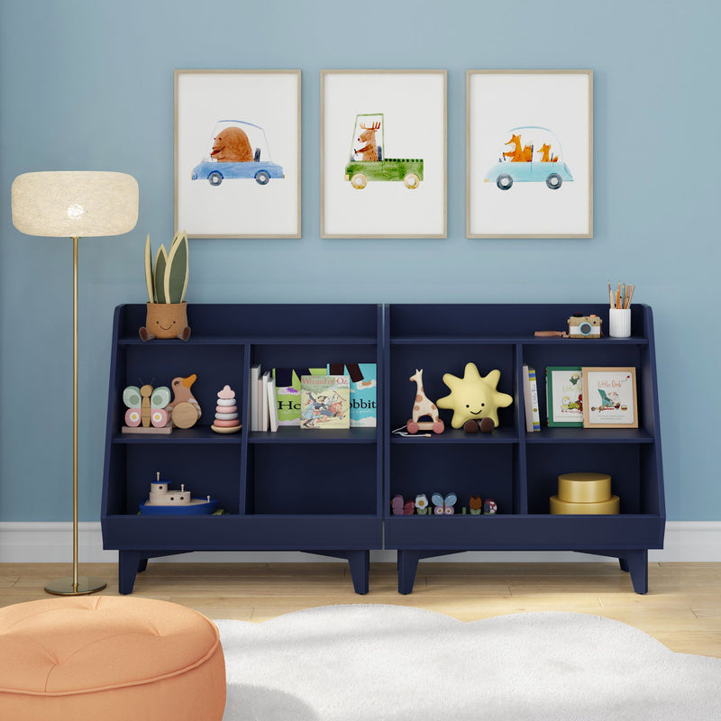 Nursery wall art: three framed watercolor animal car prints above a navy toy shelf filled with children's books, plush and wooden toys against a pale blue wall